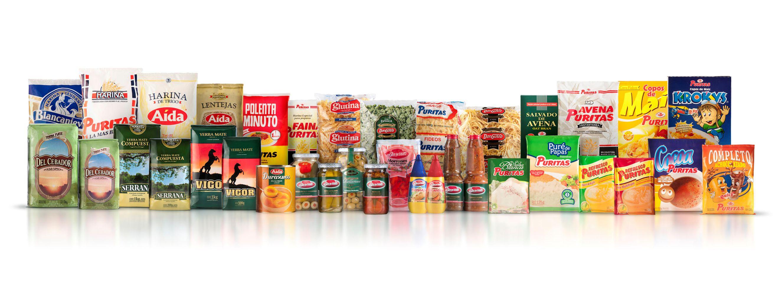 Fila de envases de productos de Molino Puritas: arroz, harinas, yerbas y conservas
